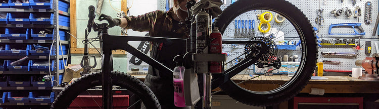mechanic working on bike